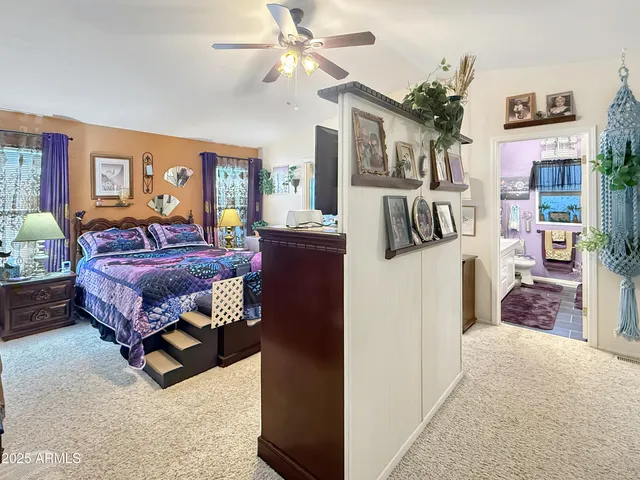 a view of a dining room with furniture and a book shelf
