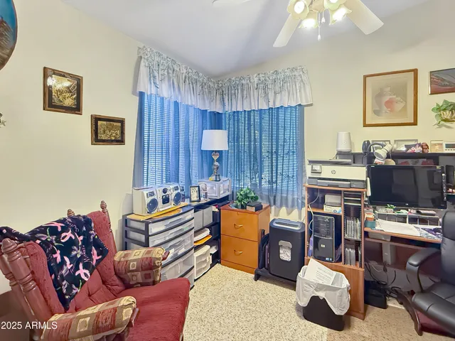 a bed room with a bed window and dresser