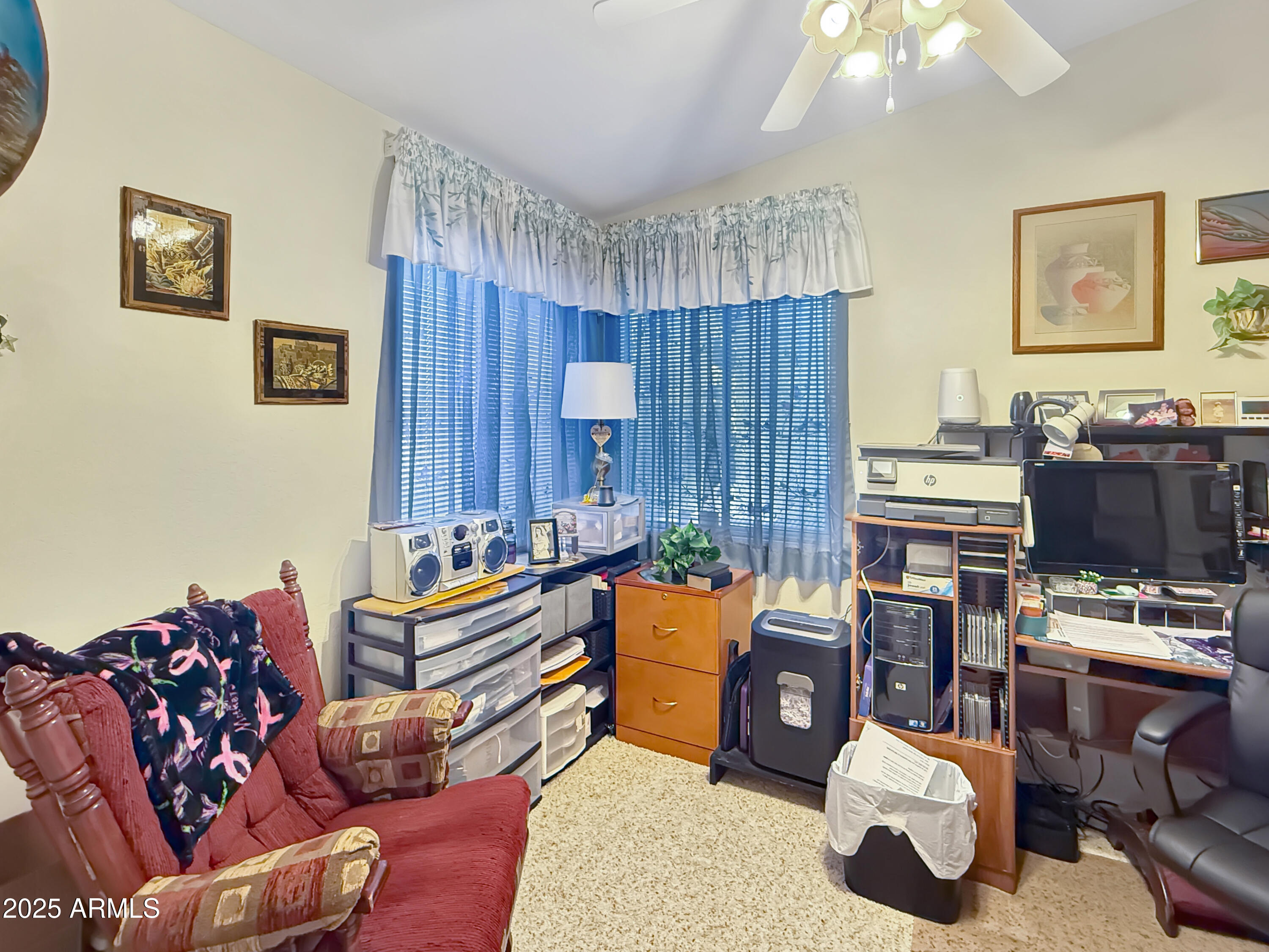 3700 South Tomahawk Road, Unit 102 Apache Junction, AZ 85119 - Photo 14 of 25 a bedroom with furniture and a window