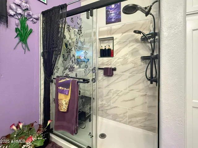 a bathroom with a sink mirror and toilet