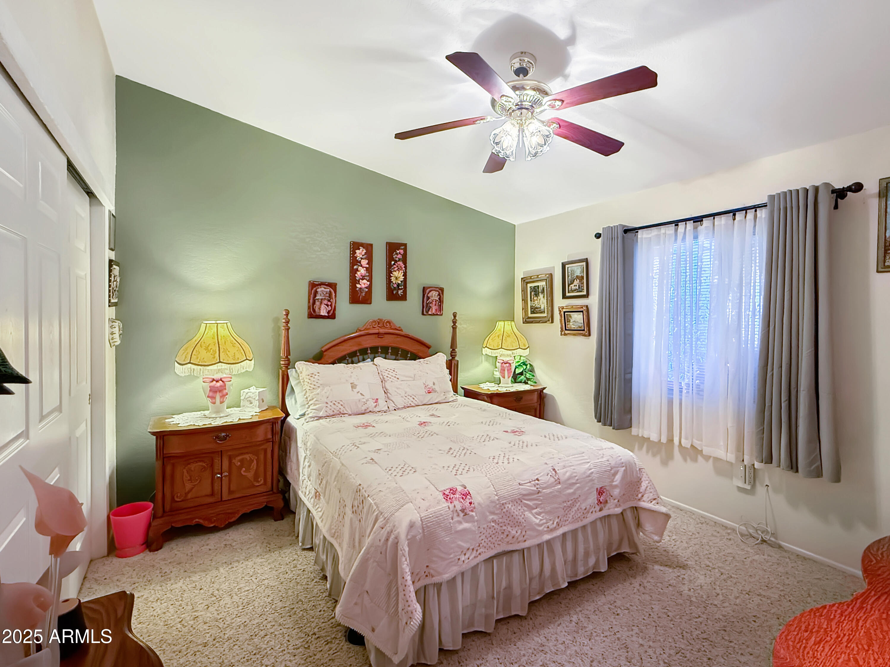 3700 South Tomahawk Road, Unit 102 Apache Junction, AZ 85119 - Photo 17 of 25 a bedroom with a bed and a chandelier