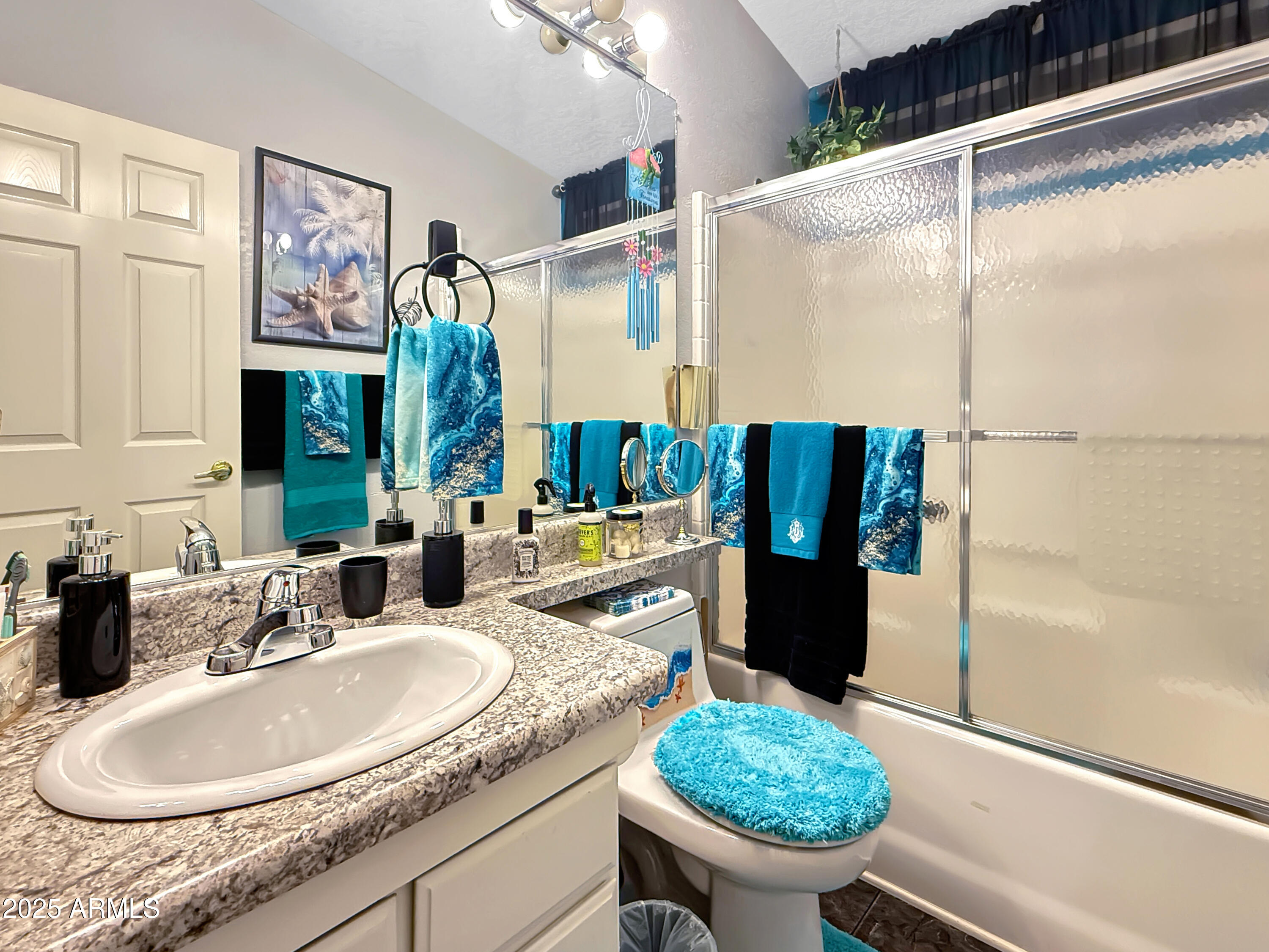 3700 South Tomahawk Road, Unit 102 Apache Junction, AZ 85119 - Photo 18 of 25 a bathroom with a granite countertop sink and a mirror