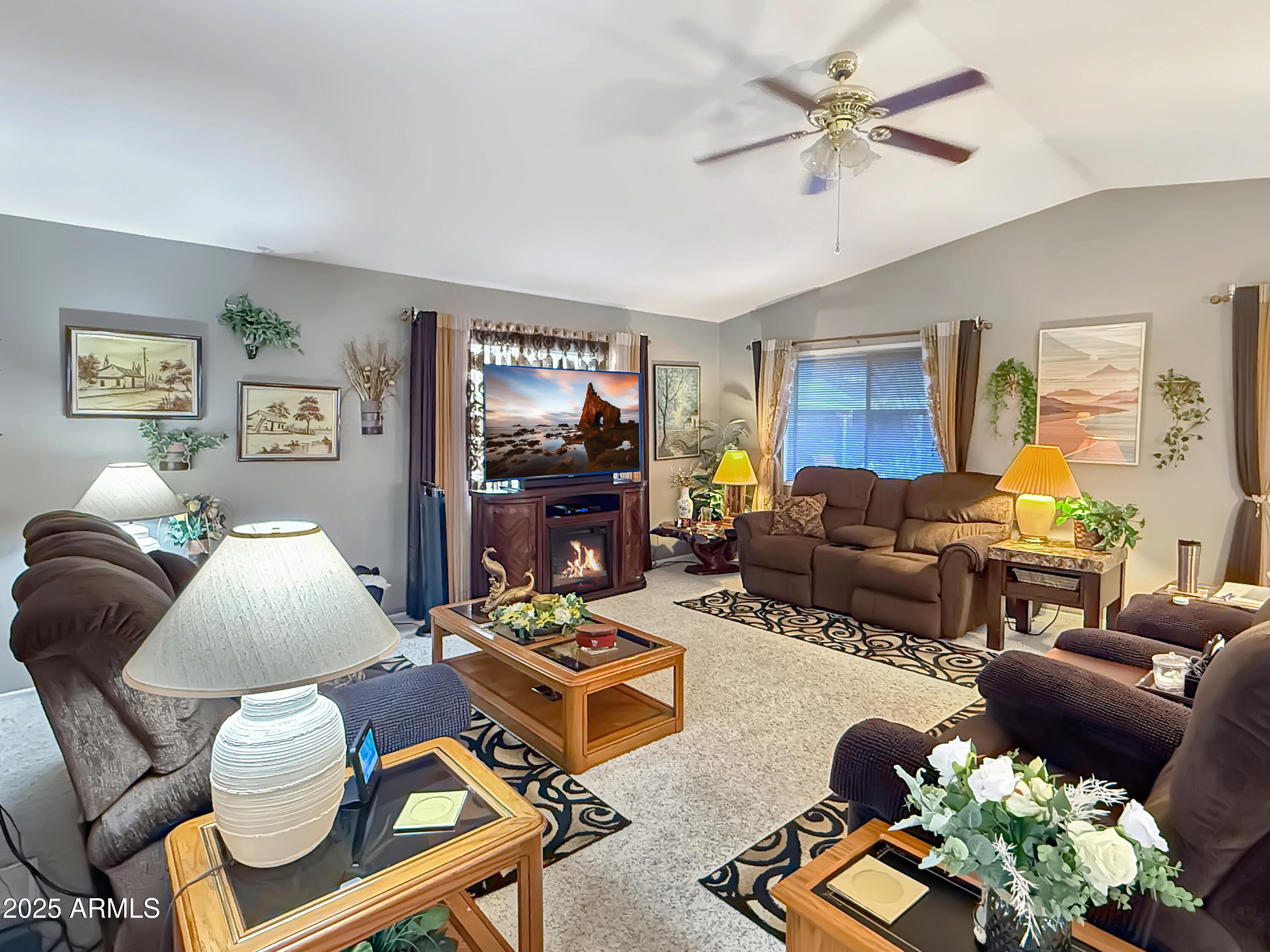 3700 South Tomahawk Road, Unit 102 Apache Junction, AZ 85119 - Photo 4 of 25 a living room with furniture potted plant and a window