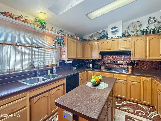 a dining room filled with furniture and a chandelier