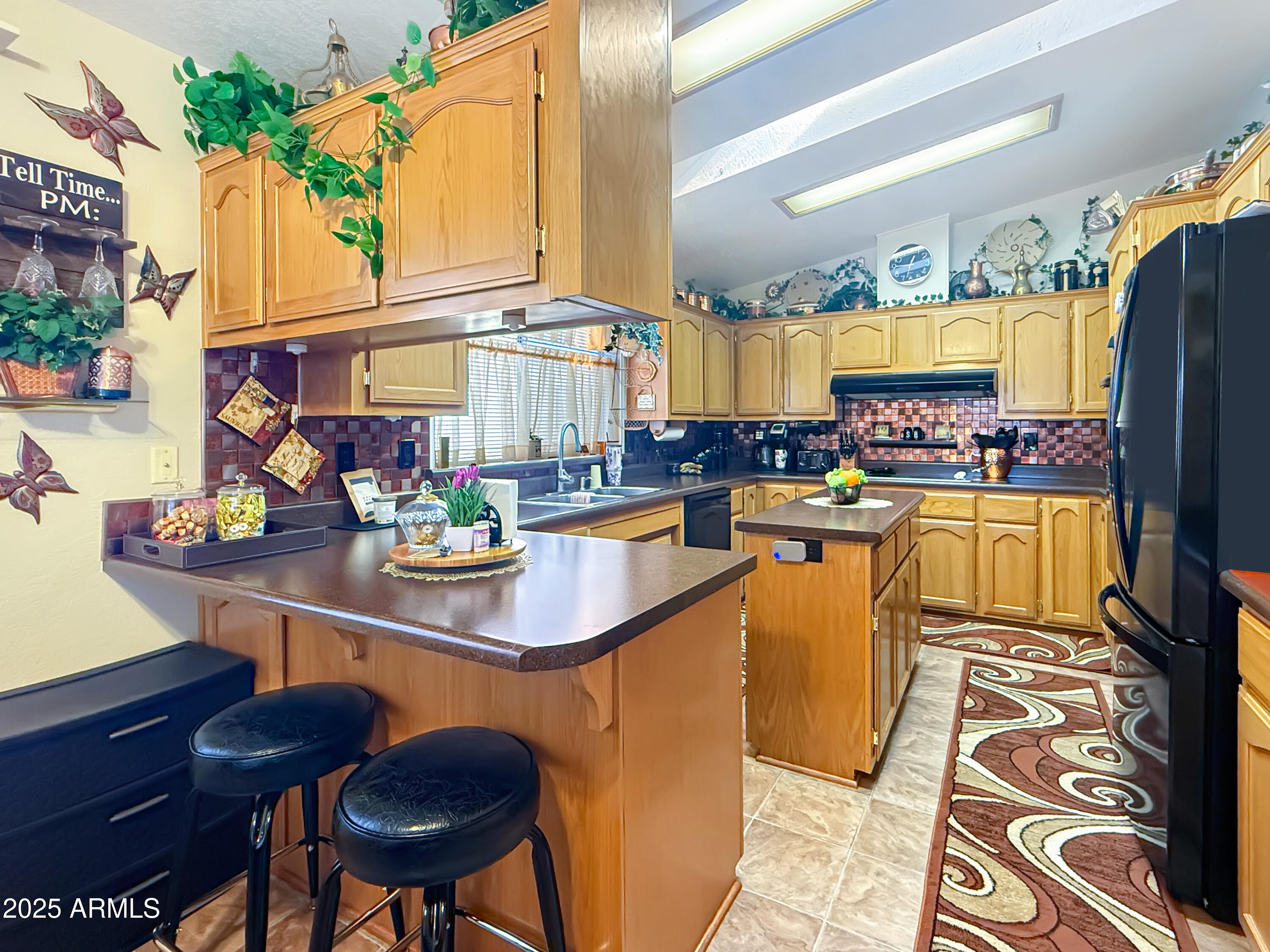 3700 South Tomahawk Road, Unit 102 Apache Junction, AZ 85119 - Photo 9 of 25 a kitchen with lots of counter top space and furniture