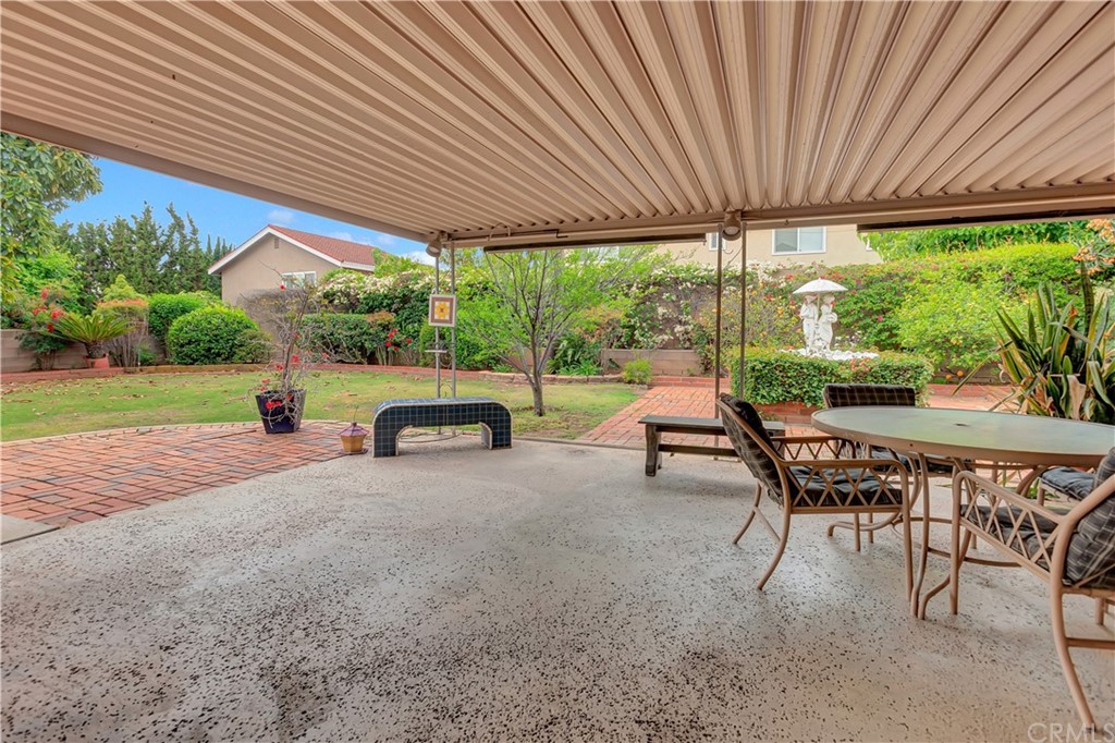 1645 Sandalwood Drive Brea, CA 92821 - Photo 15 of 16 a view of a patio with table and chairs under an umbrella