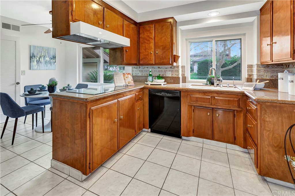 1645 Sandalwood Drive Brea, CA 92821 - Photo 8 of 16 a kitchen with stainless steel appliances granite countertop a stove a sink and a microwave