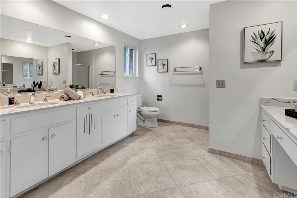 1645 Sandalwood Drive Brea, CA 92821 - Photo 10 of 16 a spacious bathroom with a double vanity sink and a mirror