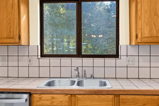 a view of a sink and a window