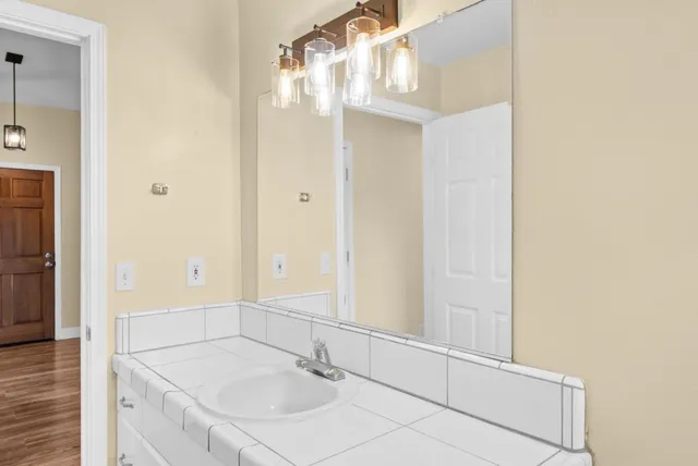 a bathroom with a sink and a mirror