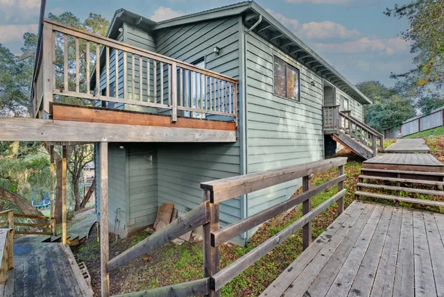 a balcony with hardwood filled with table and chairs