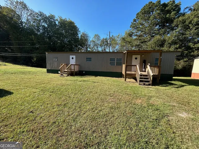 a view of a couches in backyard of house
