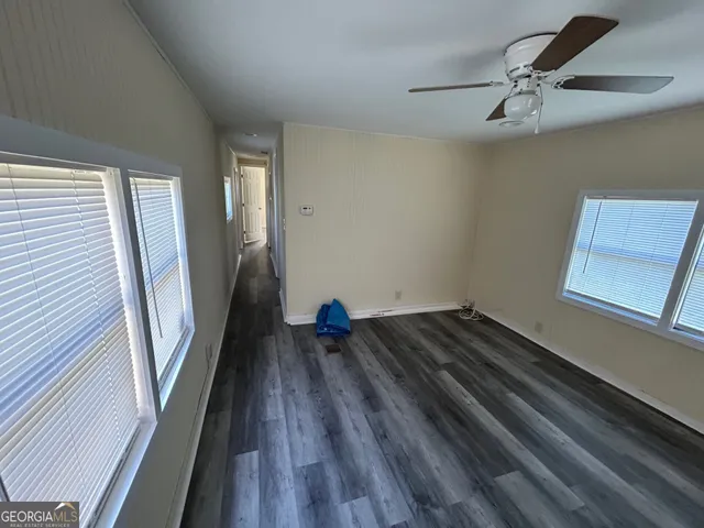 a view of a hardwood floor in a house