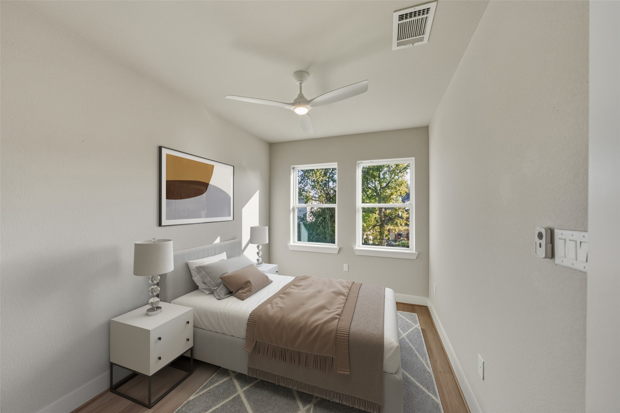 3422 Elser Street Houston, TX 77009 - Photo 15 of 26 This bedroom features a modern, minimalist design with neutral tones. Virtually staged, creating a serene atmosphere.