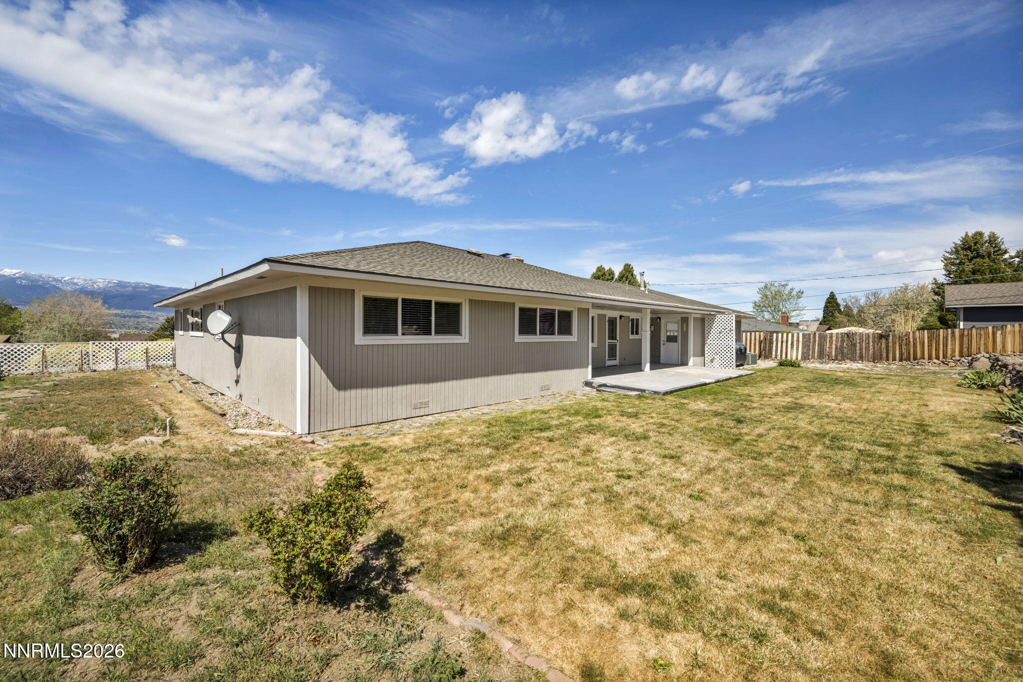 14190 Rim Rock Drive Reno, NV 89521 - Photo 55 of 68 a front view of a house with a yard