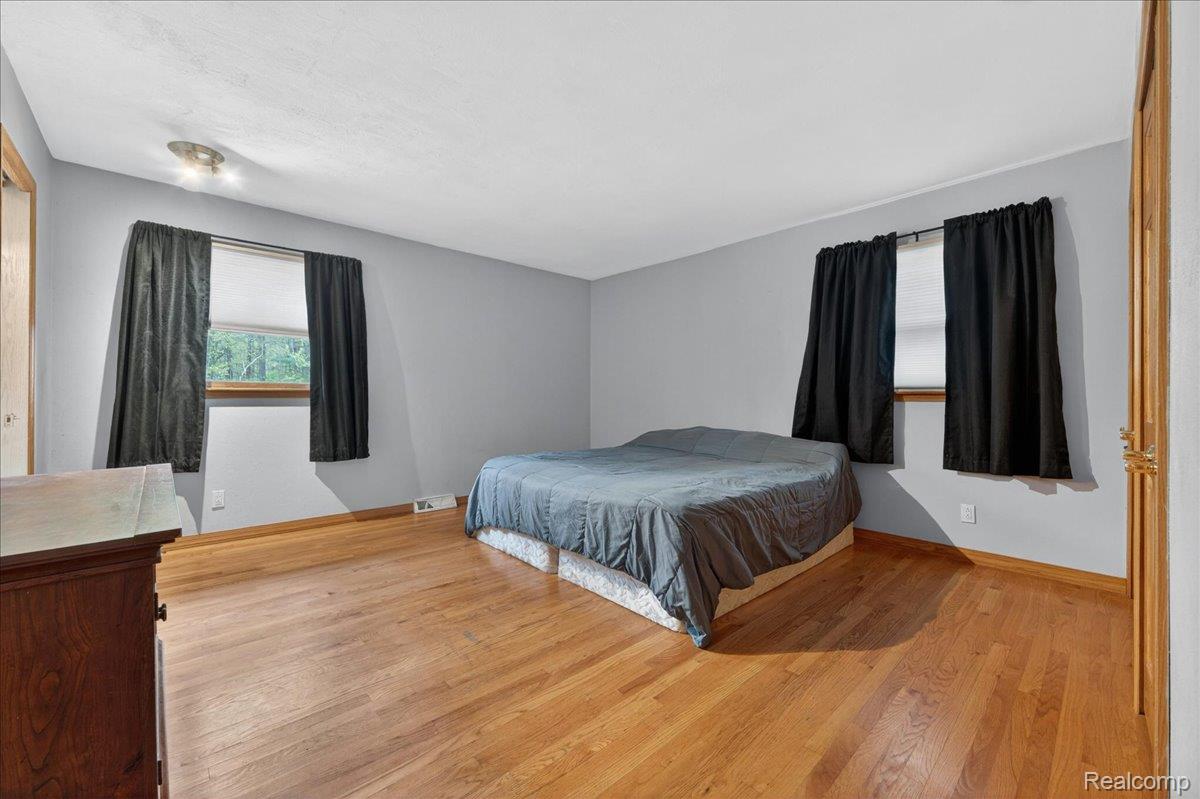 4049 Slattery Road North Branch, MI 48461 - Photo 27 of 45 Bedroom with light wood-style floors and baseboards