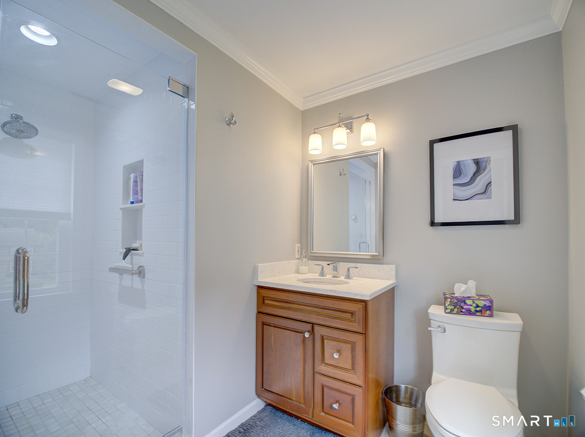 19 East Ridge Court Cheshire, CT 06410 - Photo 25 of 39 Remodeled bath with tiled shower.