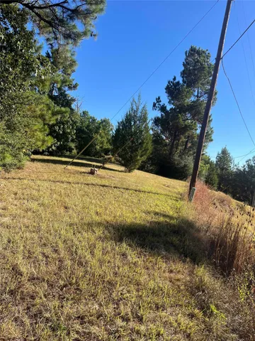 a view of a swimming pool with an outdoor space and seating area
