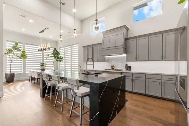 a kitchen with lots of counter top space and dining table