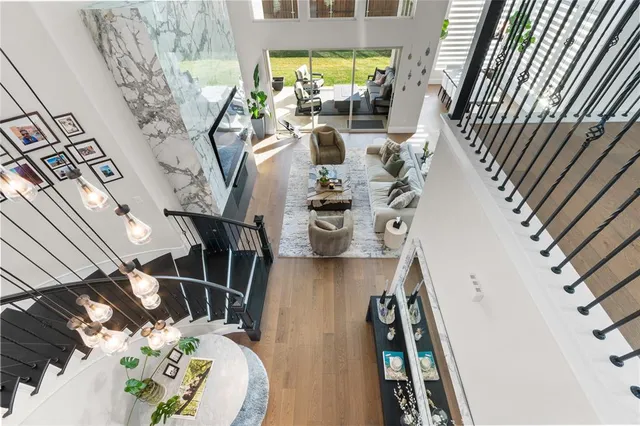 a view of living room with furniture and wooden floor