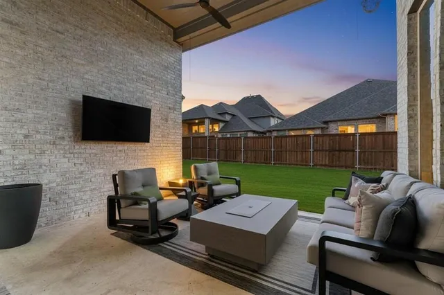a view of a patio with chair and a fireplace