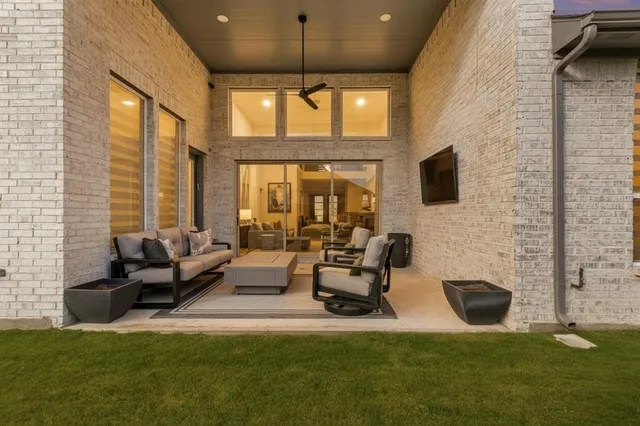 a living room with fireplace furniture and a flat screen tv