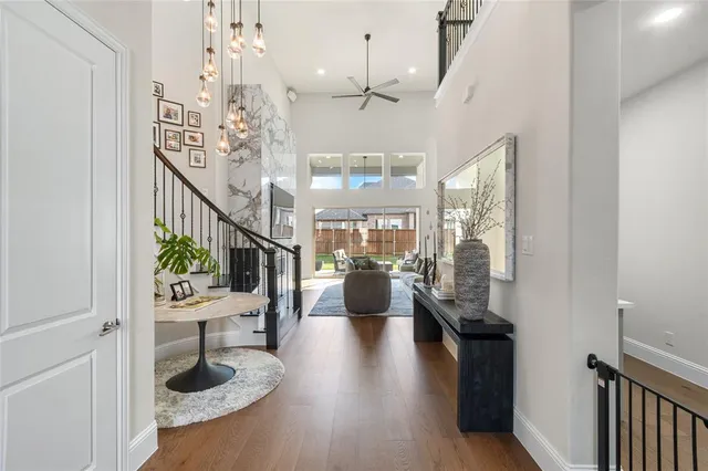 a lobby with furniture and wooden floor