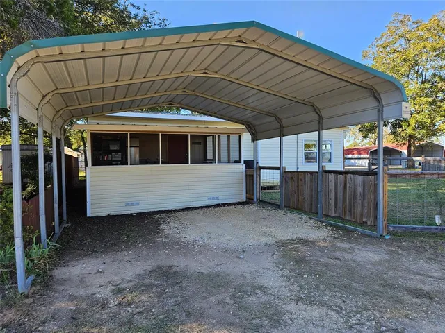 a view of a small house in a yard