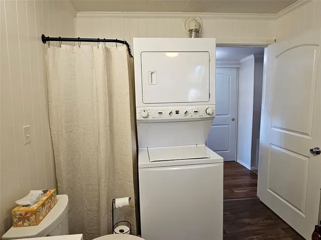 a bathroom with a toilet a sink and shower
