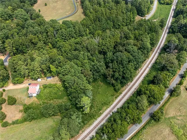 a backyard of a house with a yard and lake view