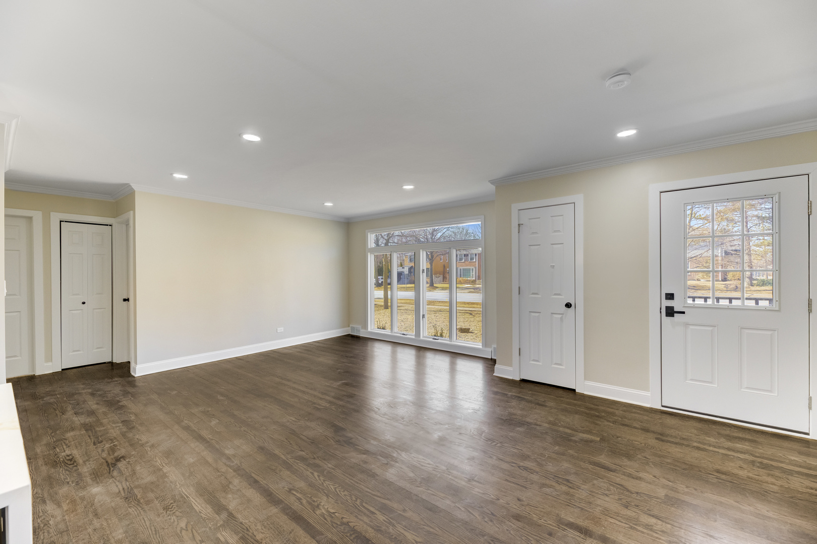 4701 Wolf Road Western Springs, IL 60558 - Photo 3 of 27 a view of an empty room with wooden floor and windows