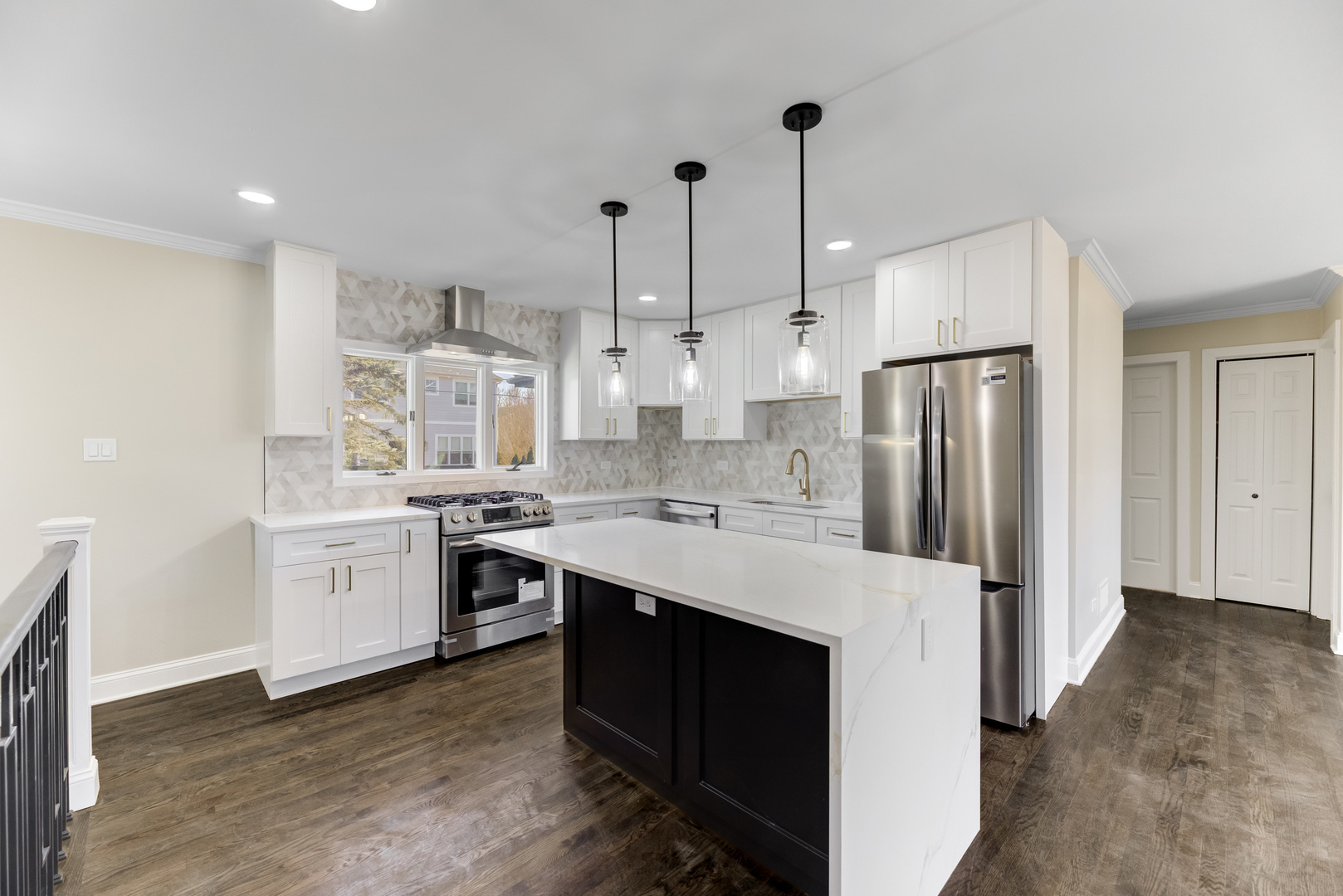 4701 Wolf Road Western Springs, IL 60558 - Photo 5 of 27 a kitchen that has a lot of white cabinets and stainless steel appliances