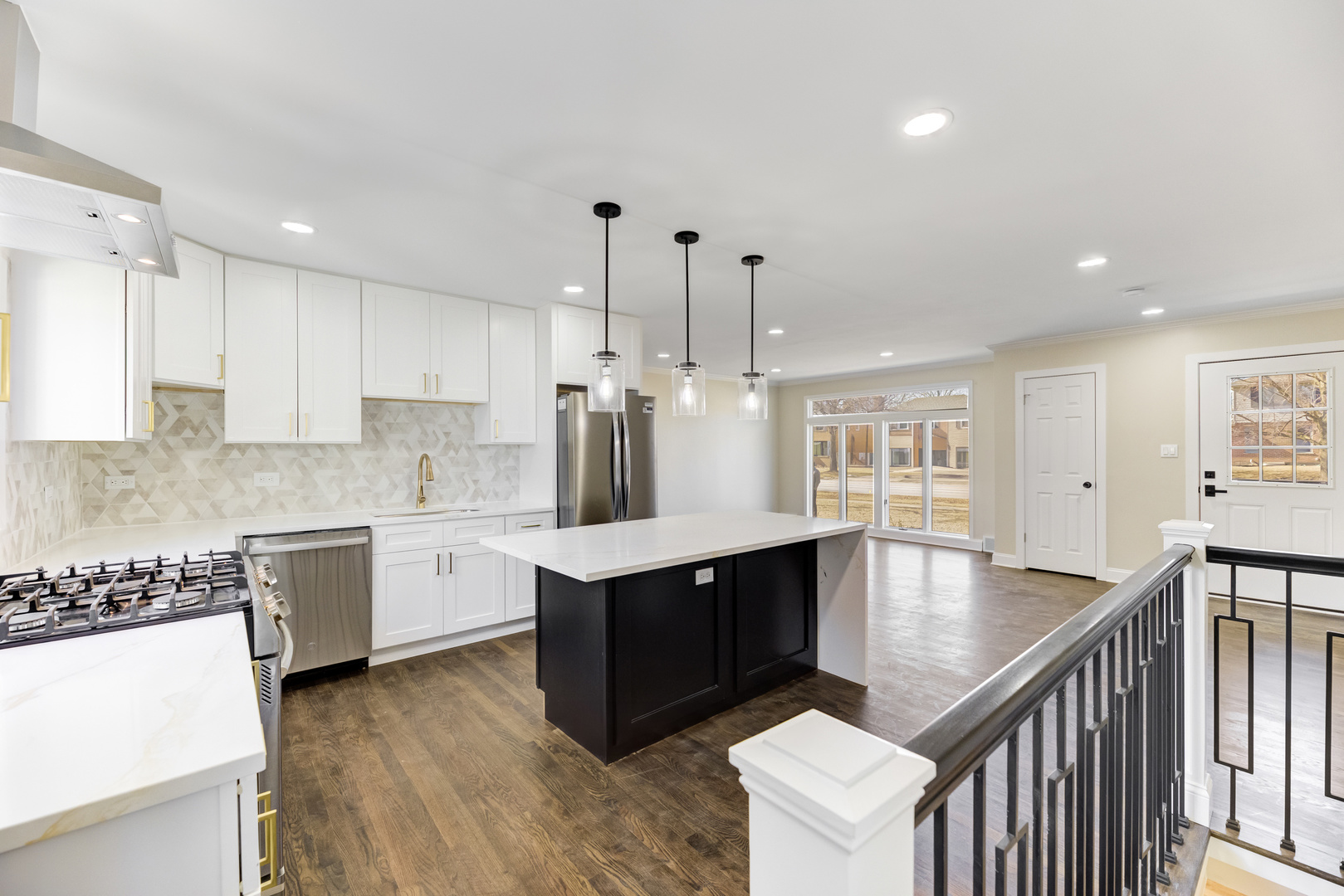 4701 Wolf Road Western Springs, IL 60558 - Photo 6 of 27 a kitchen with stainless steel appliances granite countertop a sink a stove and a wooden floors