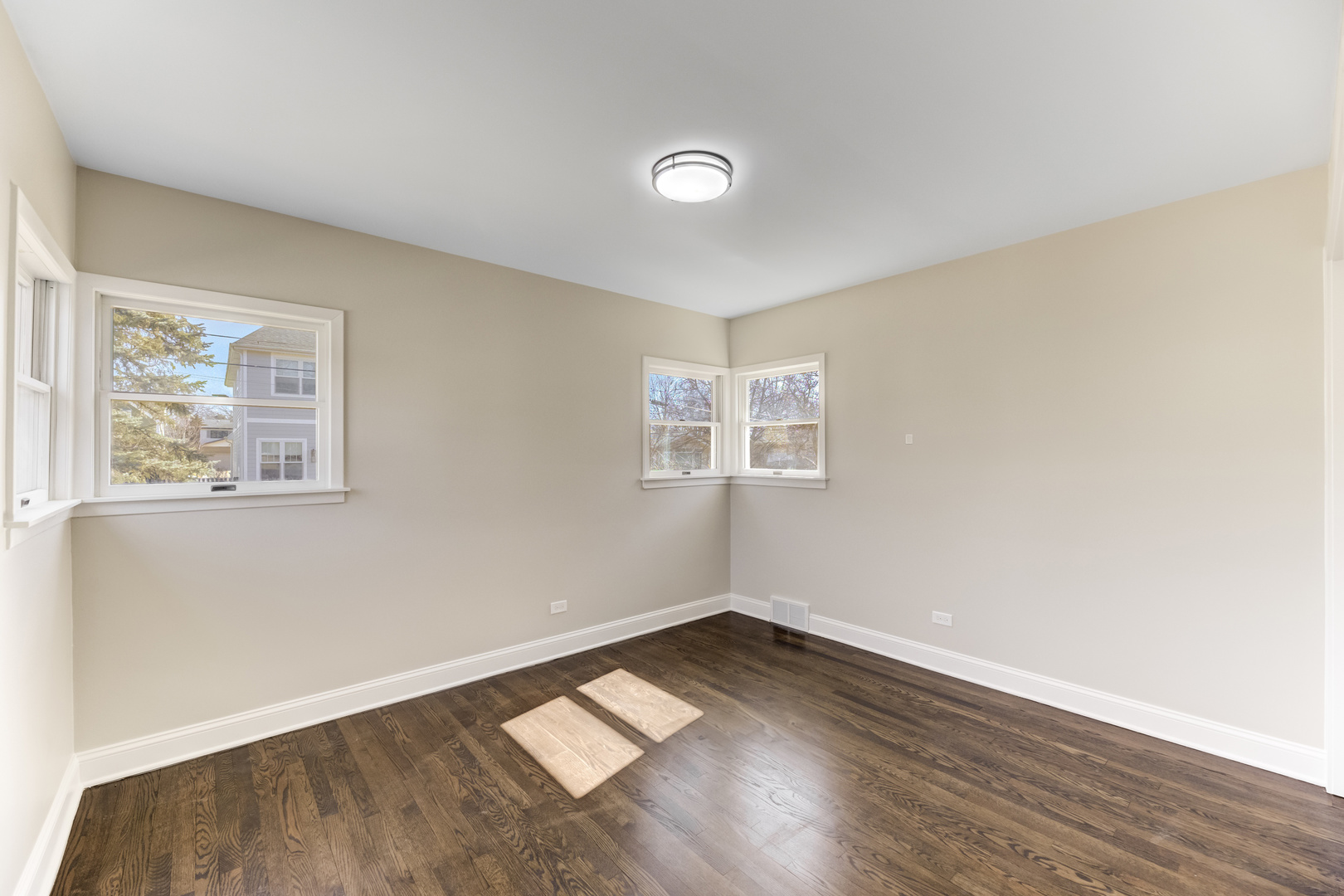 4701 Wolf Road Western Springs, IL 60558 - Photo 7 of 27 a view of empty room with wooden floor and fan