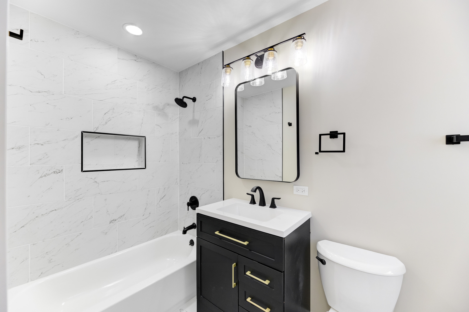 4701 Wolf Road Western Springs, IL 60558 - Photo 8 of 27 a bathroom with a toilet sink and mirror