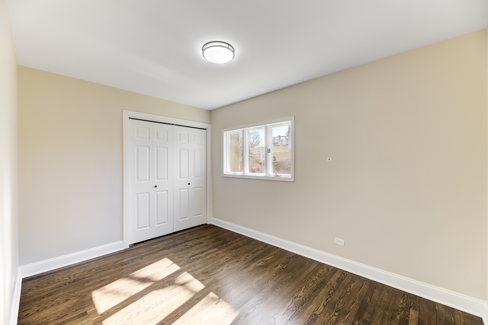 4701 Wolf Road Western Springs, IL 60558 - Photo 10 of 27 a view of empty room with wooden floor and fan