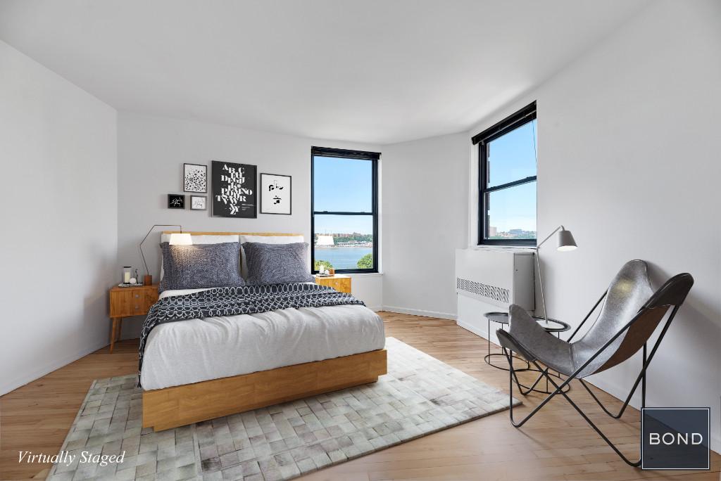 a bedroom with a bed and a chair