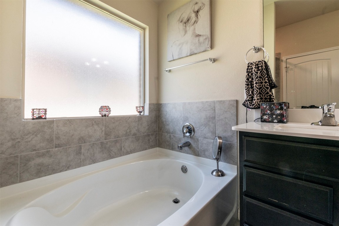 205 Pepper Mill Loop Burnet, TX 78611 - Photo 12 of 25 a bathroom with a bathtub and sink