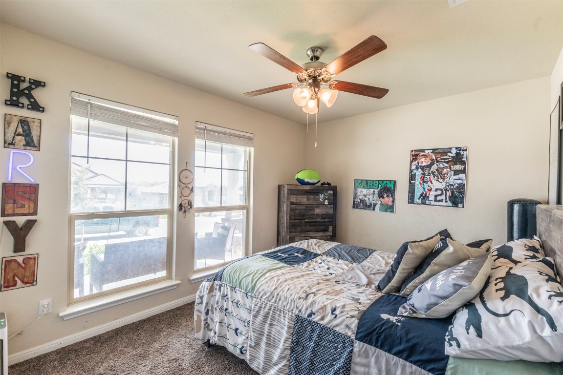 205 Pepper Mill Loop Burnet, TX 78611 - Photo 18 of 25 a bedroom with bed and a window