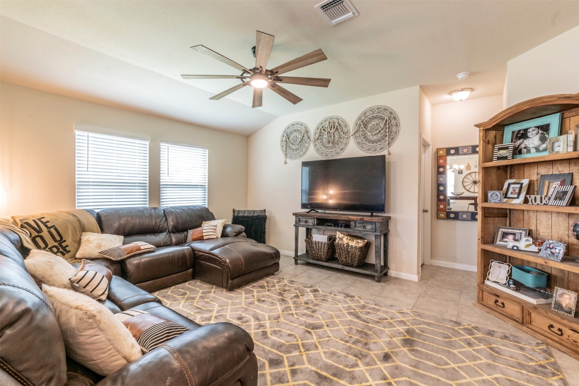 205 Pepper Mill Loop Burnet, TX 78611 - Photo 2 of 25 a living room with furniture and a flat screen tv