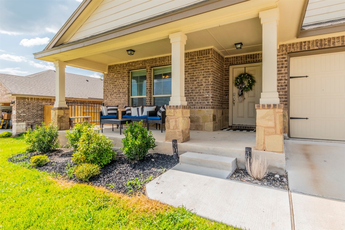 205 Pepper Mill Loop Burnet, TX 78611 - Photo 22 of 25 a front view of a house with garden