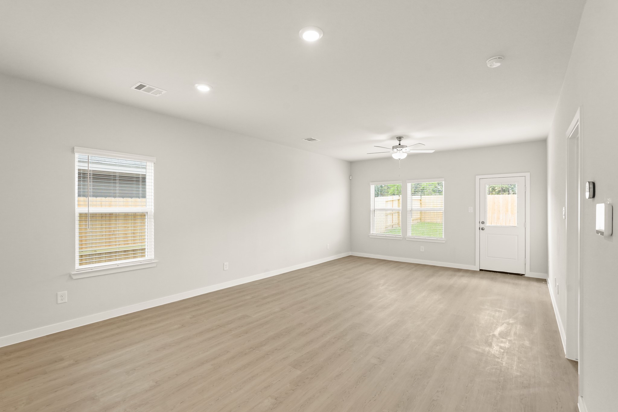 113 Rising Cedar Lane Hockley, TX 77447 - Photo 8 of 27 an empty room with windows and closet