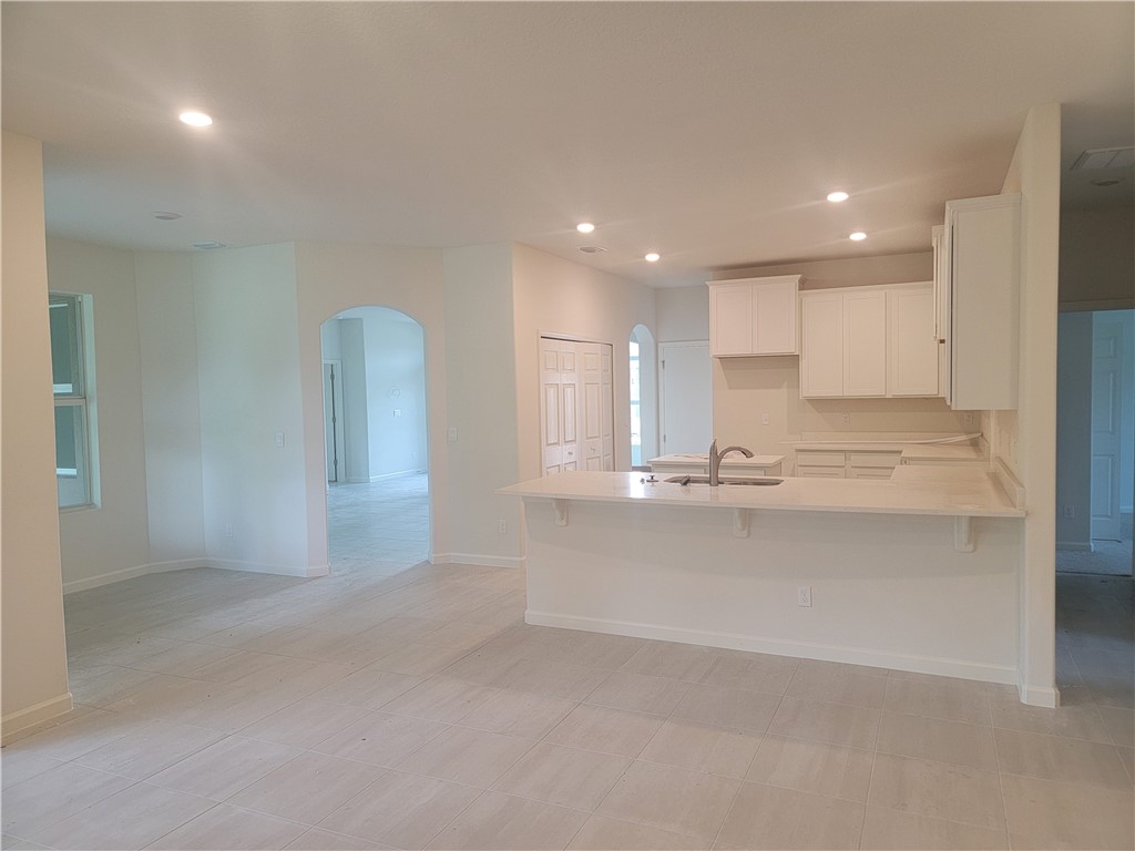 107 52nd Square Vero Beach, FL 32968 - Photo 3 of 20 a view of a kitchen with a sink