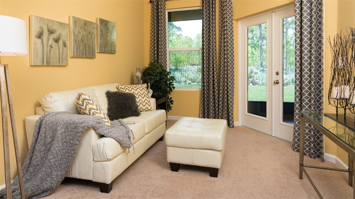 107 52nd Square Vero Beach, FL 32968 - Photo 8 of 20 a living room with furniture and a large window