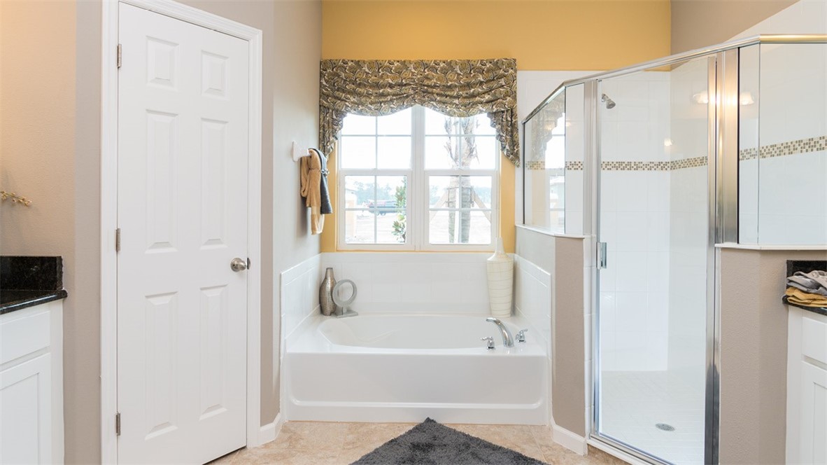 107 52nd Square Vero Beach, FL 32968 - Photo 10 of 20 a bathroom with a bathtub and a shower