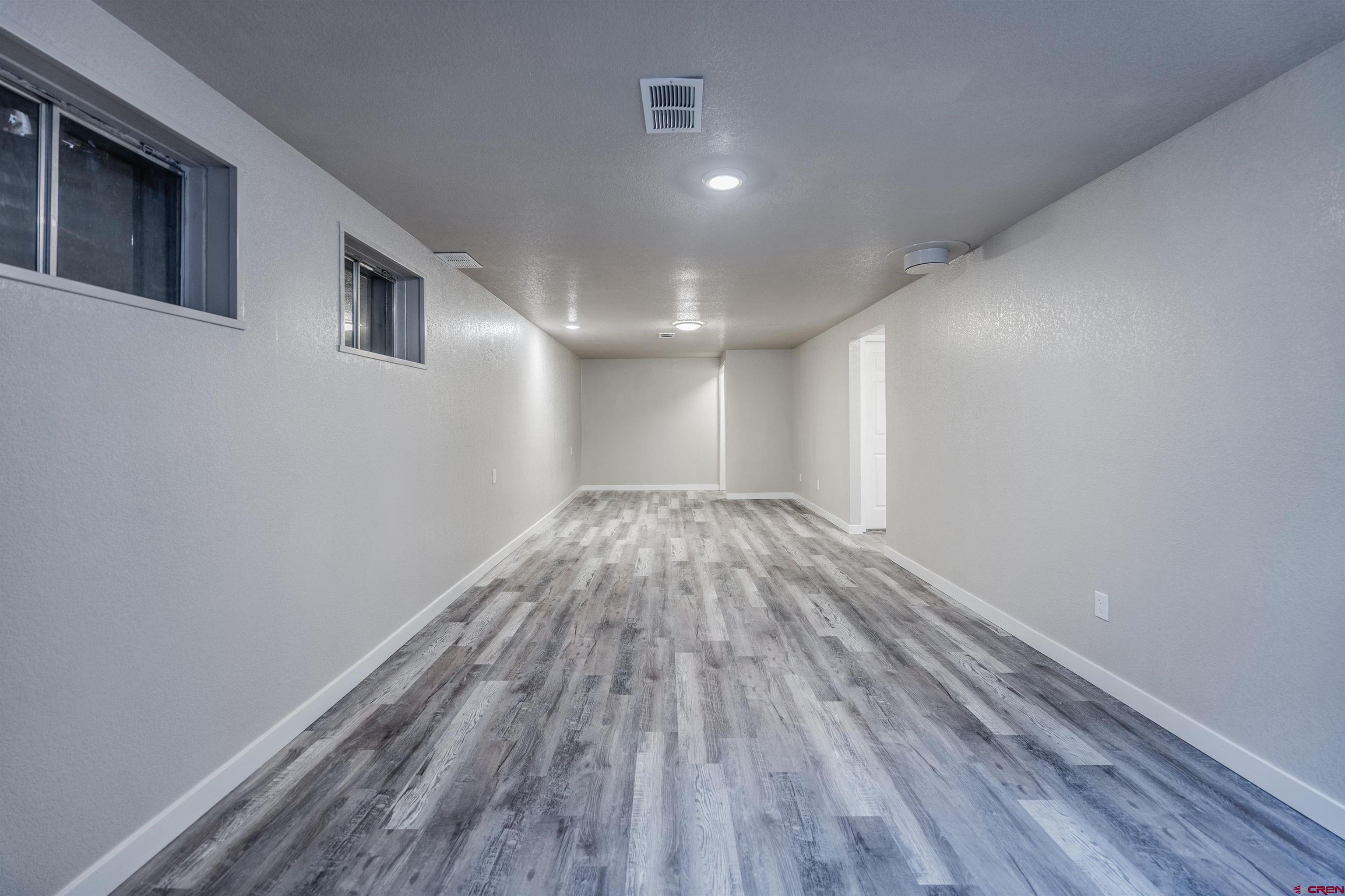 2130 Devon Street Montrose, CO 81401 - Photo 13 of 27 a view of empty room with wooden floor