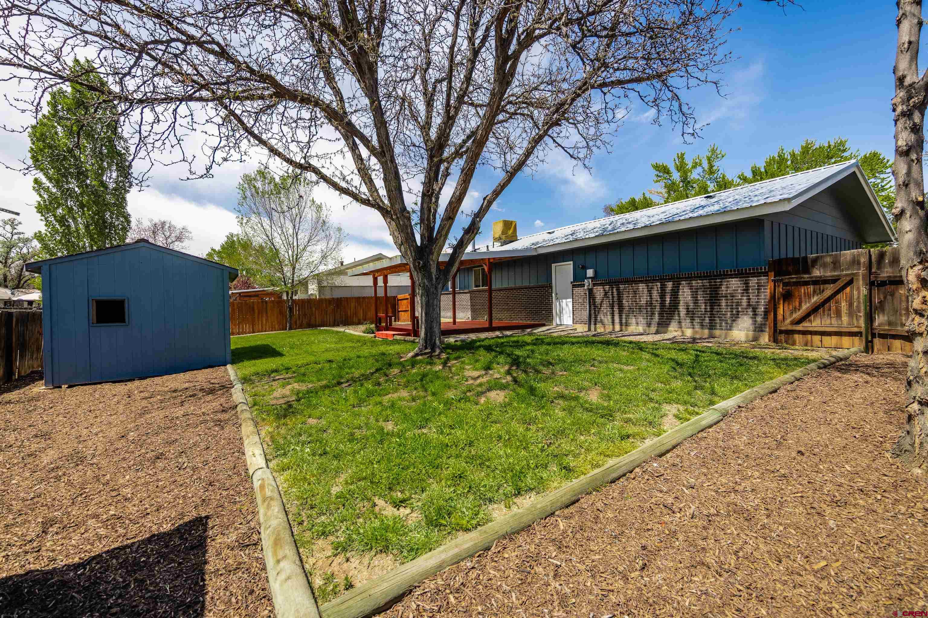 2130 Devon Street Montrose, CO 81401 - Photo 20 of 27 a front view of a house with garden