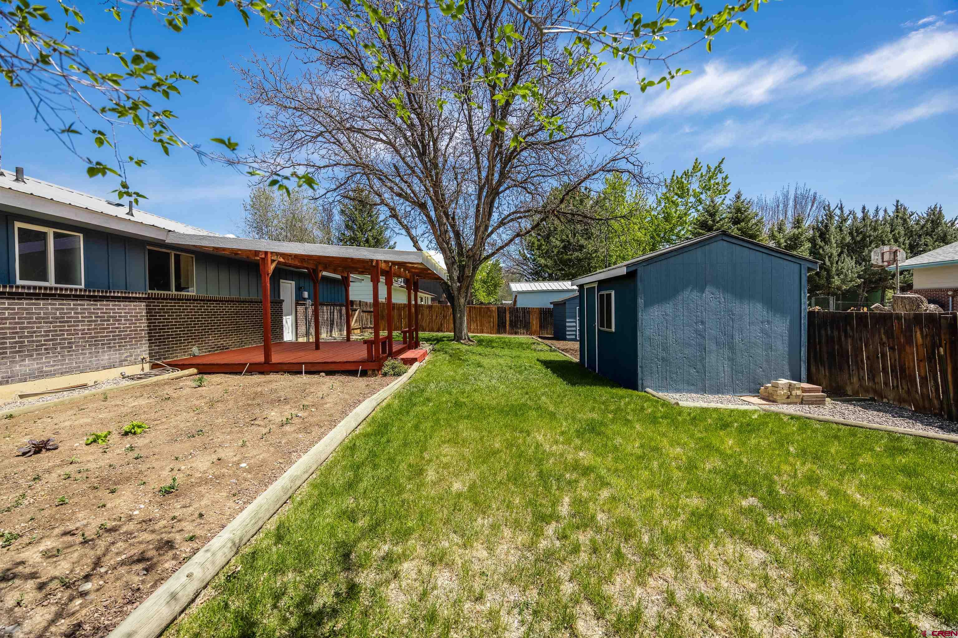 2130 Devon Street Montrose, CO 81401 - Photo 21 of 27 a view of a house with a yard