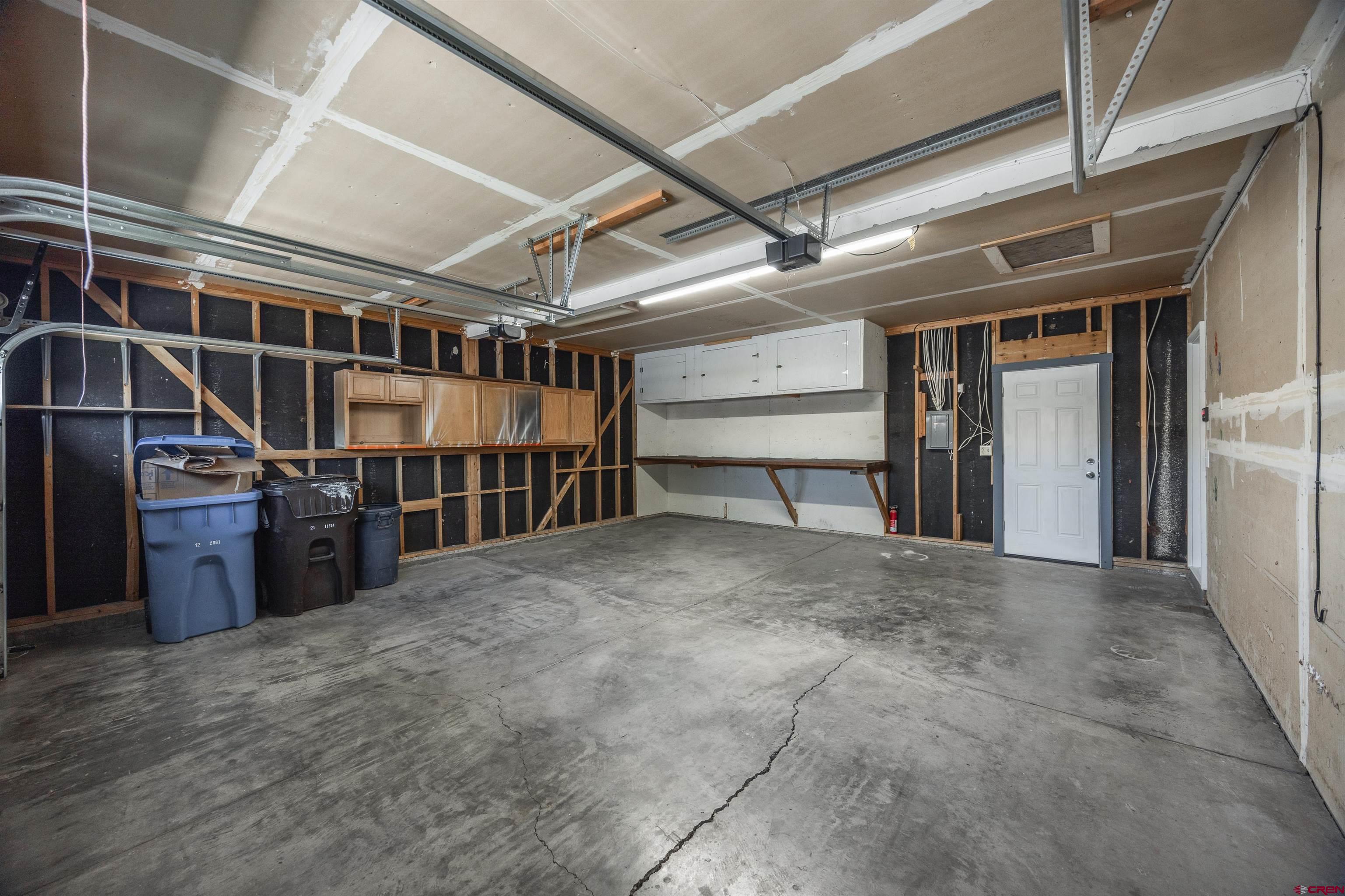 2130 Devon Street Montrose, CO 81401 - Photo 24 of 27 a view of an empty room with wooden floor