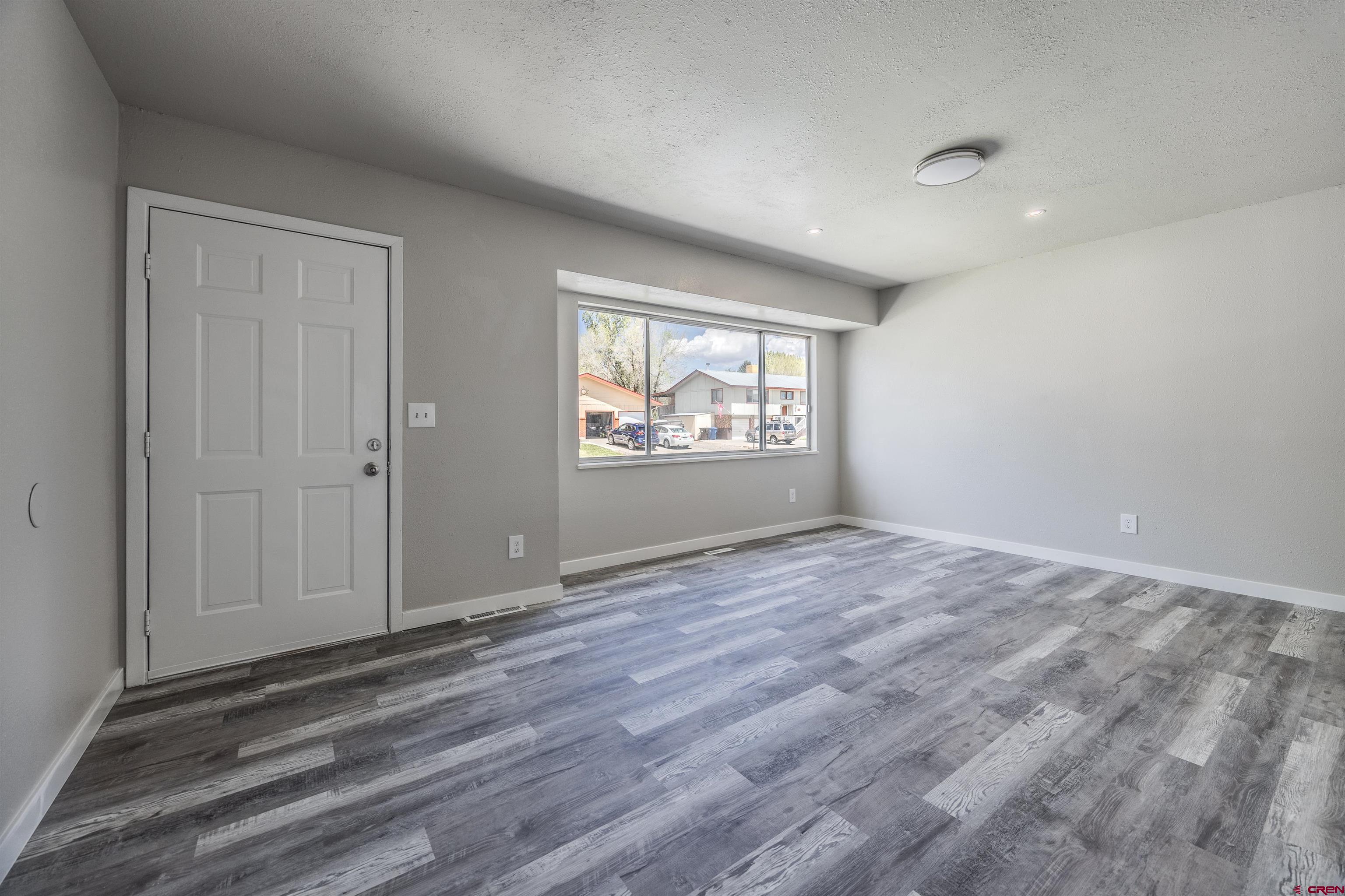 2130 Devon Street Montrose, CO 81401 - Photo 4 of 27 a view of an empty room and window